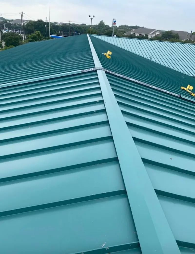 Green commercial metal roof ridge and valley for Metal Roof Repair in Manchester-by-the-Sea